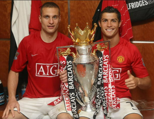 Nemanja Vidic and Cristiano Ronaldo of Manchester United celebrate with the Premier League trophy in the dressing room after the Barclays Premier League match between Manchester United and Arsenal at Old Trafford on May 16, 2009 in Manchester, England ...