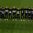 Germany's players pose for a group photo with the wording "Human rights" on their T-shirts prior to the their World Cup qualifier with Iceland