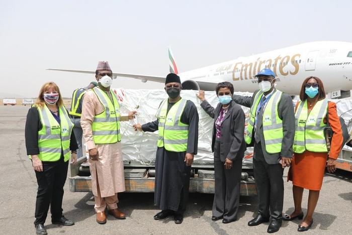 Nigerians officials, including the Minister of Health, Dr. Osagie Ehanire, receive the 3.92 million doses of AstraZeneca COVID-19 vaccine on arrival. [Twitter/@WHONigeria]