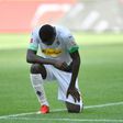 Marcus Thuram took the knee after scoring in May's Bundesliga win over Union Berlin