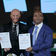 FIFA Chairman of Referees, Pierluigi Collina, with the Presidents of FIFA and CAF display the MoU.