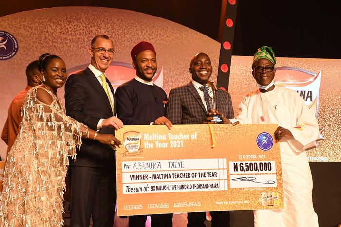 L-R: Corporate Affairs Director, Nigerian Breweries Plc, Sade Morgan; Managing Director, Nigerian Breweries Plc, Hans Essaadi; Minister of State for Education, Chukwuemeka Nwajiuba; Winner, 2021 Maltina Teacher of the Year, Taiye Abanika; and Chairman,...