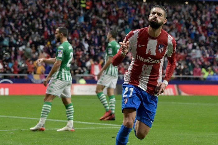 Yannick Carrasco celebrates giving Atletico Madrid the lead against Real Betis