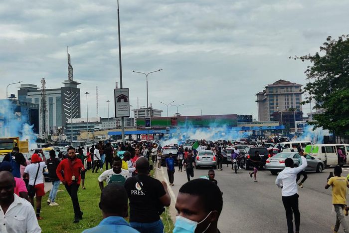 Police dispersing #EndSARSMemorial protesters with teargas canisters