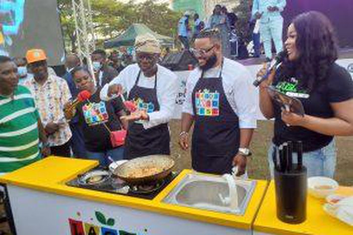 Gov. Babajide Sanwo-Olu of Lagos State, preparing fried seafood rice with celebrity chef, Diary of a Kitchen Lover and Big Brother Nigeria winner, Whitemoney, during the 2021 Lagos Food Fest on Sunday at Muri Okunola park, Lagos. (NAN PHOTO)
