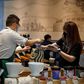 A staff member serves a customer at a Starbucks Coffee house in Beijing