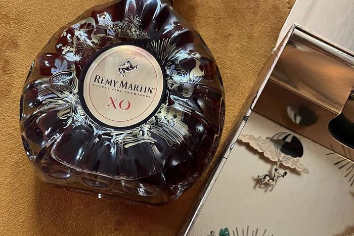 Remy Martin celebrates Team up for Excellence awardee Bayo Oke Lawal @theorangenerd with limited edition 24 Carat gold decanter