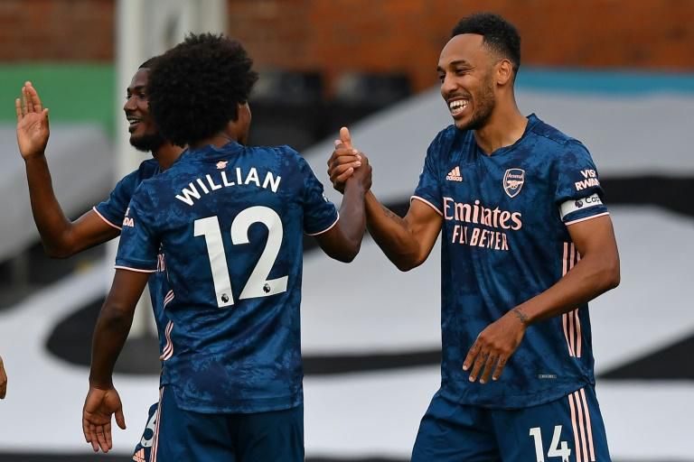 Arsenal's Pierre-Emerick Aubameyang (right) and Willian celebrate a goal against Fulham