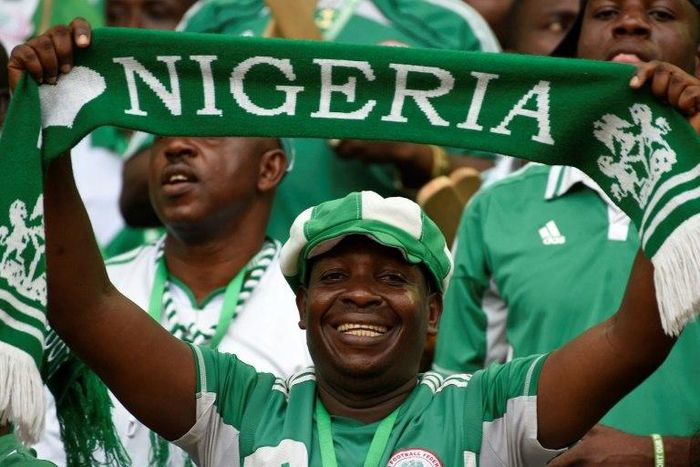 Nigeria fans cheer during the 2018 FIFA World Cup qualifying football match between Nigeria and Cameroon at Godswill Akpabio International Stadium in Uyo, Nigeria, on September 1, 2017