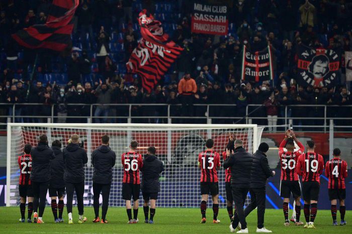 AC Milan's players acknowledge their supporters after defeat to Liverpool and their exit from the Champions League
