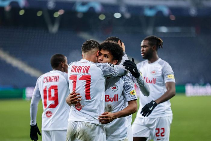 Karim Adeyemi and Noah Okafor in a warm embrace.