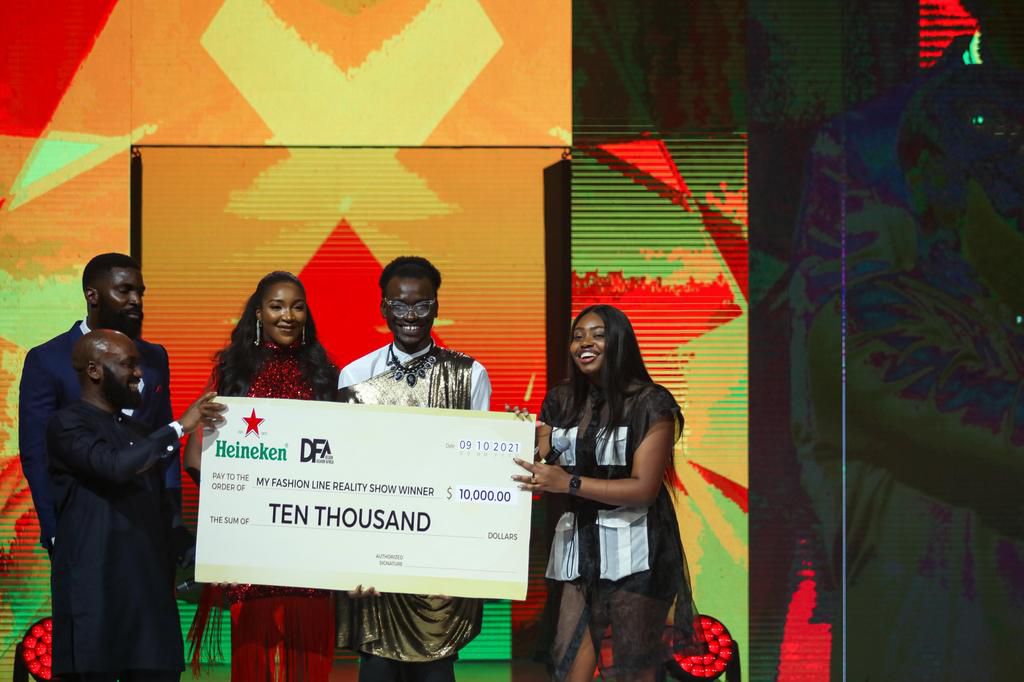 Winner of the prize posing with her cheque