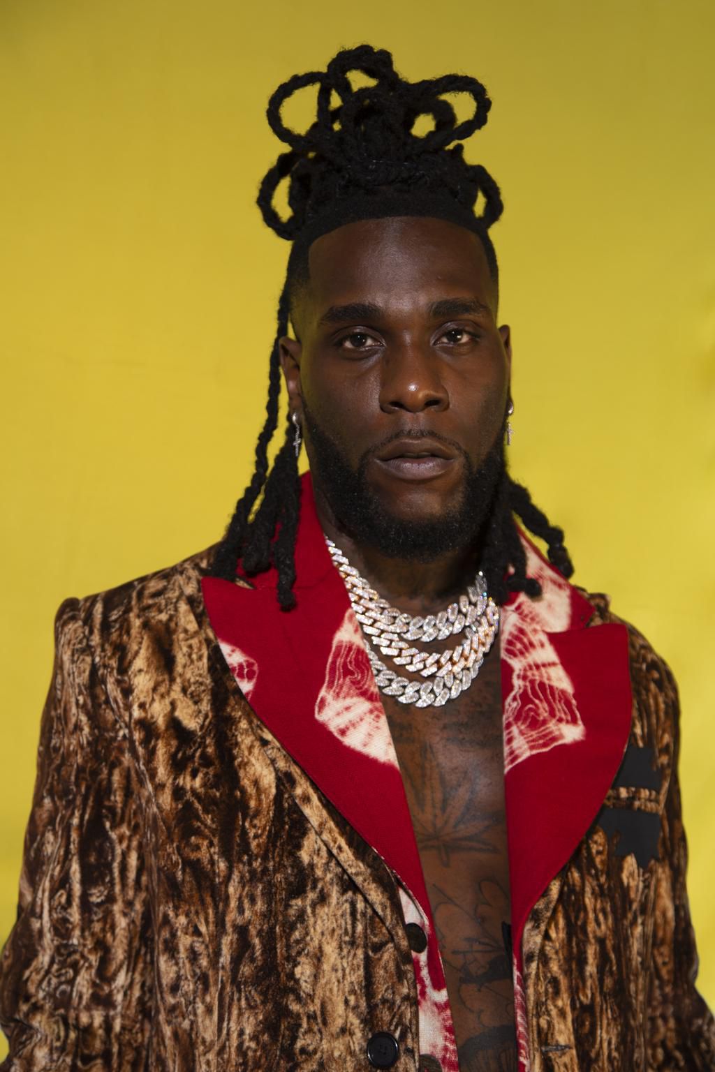 Burna Boy's hair is groomed by Mata Marielle