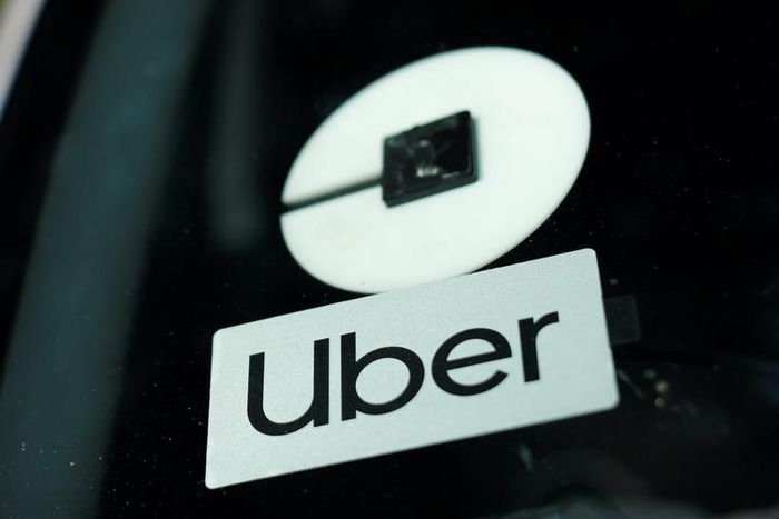 An Uber logo is shown on a rideshare vehicle during a statewide day of action to demand that ride-hailing companies Uber and Lyft follow California law and grant drivers "basic employee rights'', in Los Angeles, California, U.S., August 20, 2020.