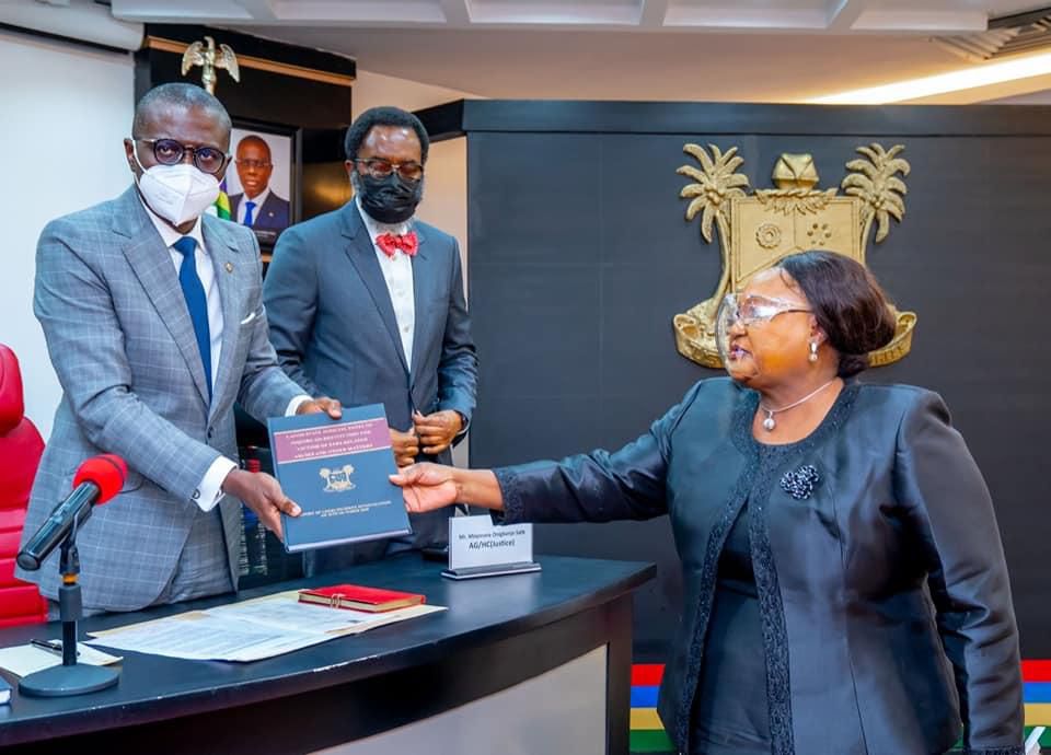 Lagos State governor, Babajide Sanwo-Olu (left), receives the report of the Judicial Panel of Inquiry from panel chairperson, the retired Justice Doris Okuwobi (right) [LASG]