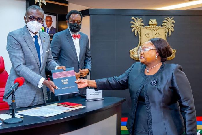Lagos State governor, Babajide Sanwo-Olu (left), receives the report of the Judicial Panel of Inquiry from panel chairperson, the retired Justice Doris Okuwobi (right) [LASG]