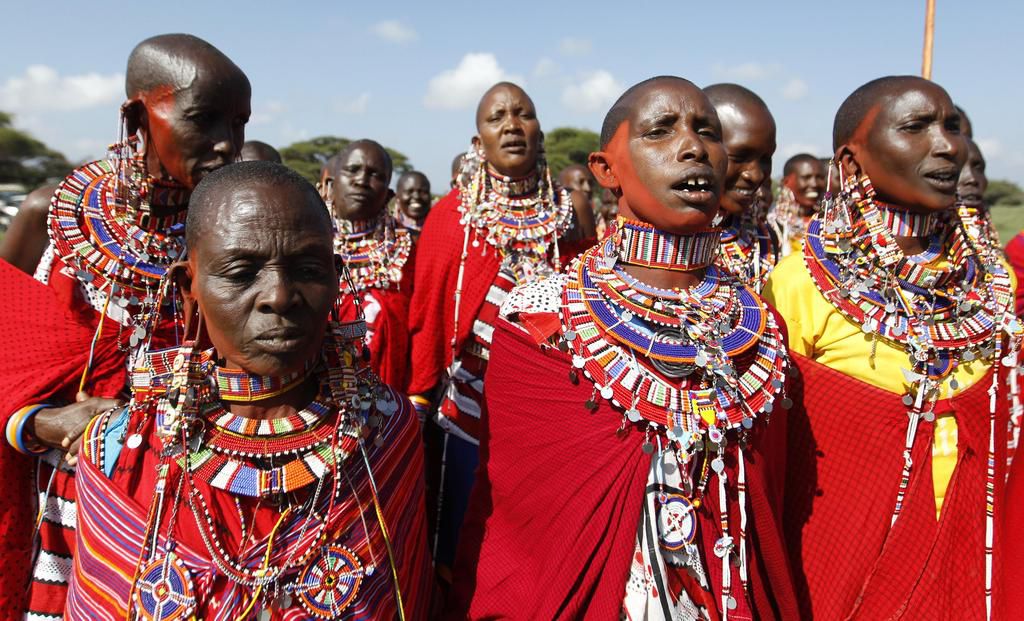 Maasai women, dressed in their traditional attire, sing during the Maasai Olympics 2014 at the Sidai Oleng wildlife sanctuary at the base of Mt. Kilimanjaro near the Kenya-Tanzania border in Kajiado December 13, 2014.  (Reutersconnect)