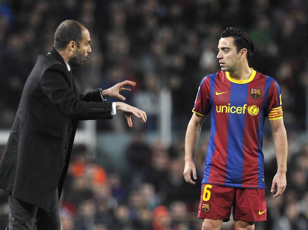 guardiola instructs xavi