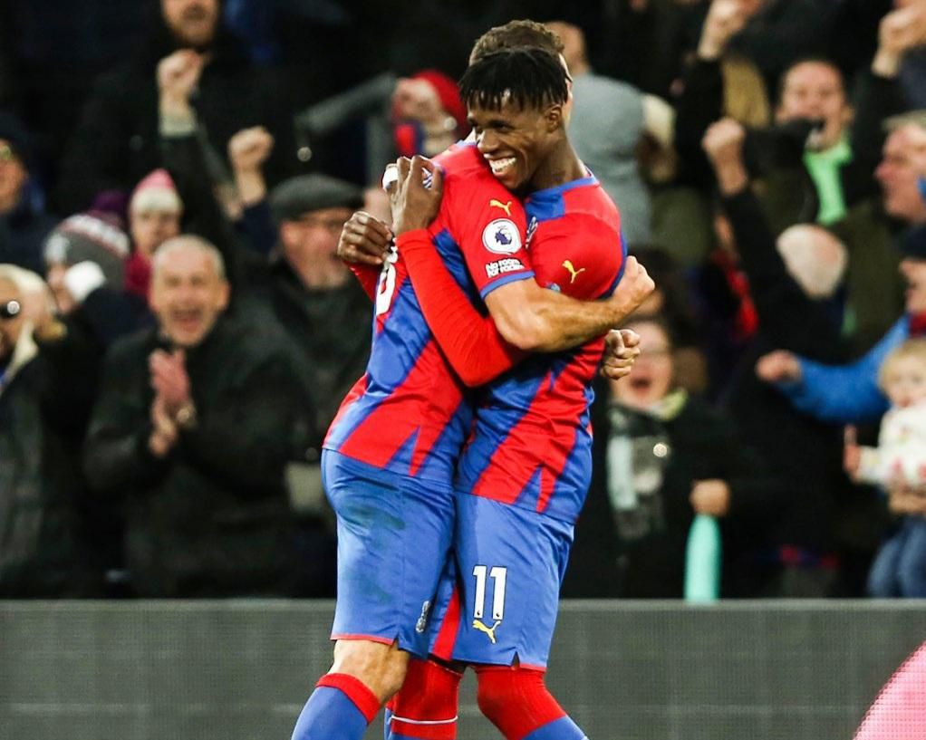 Zaha celebrates his goal with McArthur