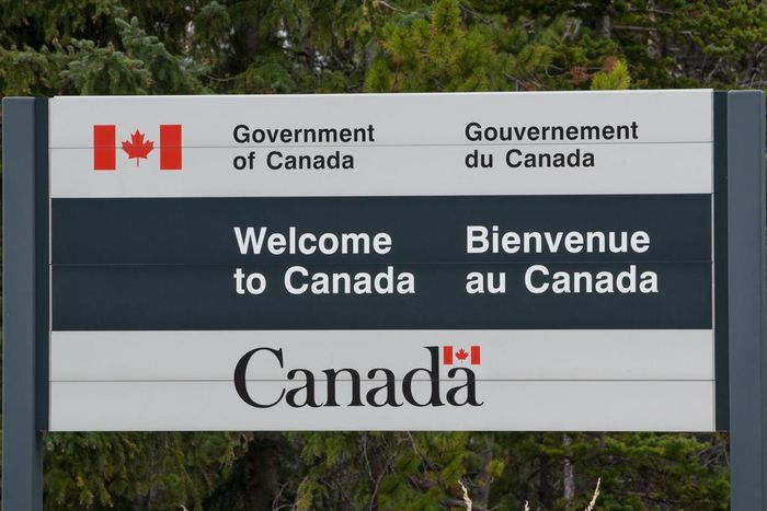 A "Welcome to Canada" sign at the US-Canada border.
