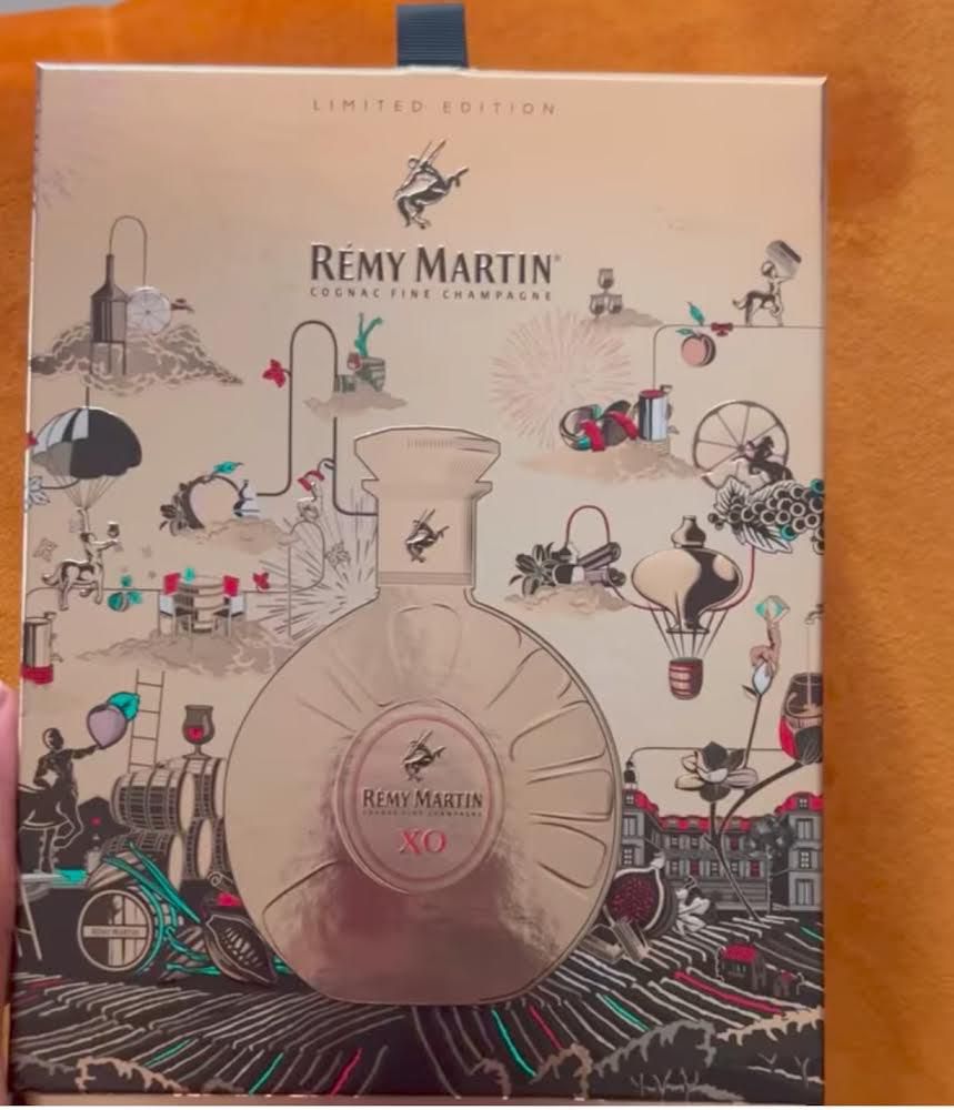 Remy Martin celebrates Team up for Excellence awardee Bayo Oke Lawal @theorangenerd with limited edition 24 Carat gold decanter