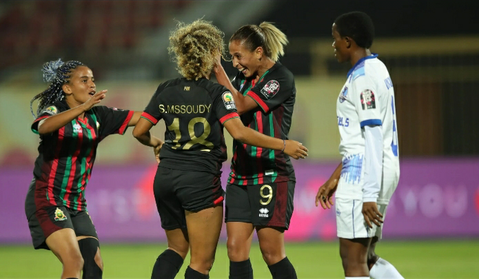 Sanaa Mssoudy celebrates with her teammates.