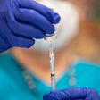 A nurse fills up a syringe with the Moderna COVID-19 vaccine at a vaccination site at a senior center on March 29, 2021 in San Antonio, Texas