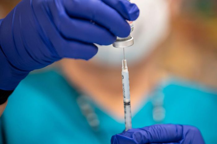 A nurse fills up a syringe with the Moderna COVID-19 vaccine at a vaccination site at a senior center on March 29, 2021 in San Antonio, Texas
