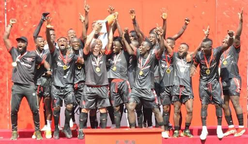 Winners of the Budweiser Game of Kings Football Match, Smooth FC led by Team Manager, Osinachi Egbuche (Left) and Team Captain, International Football Legend, Roberto Carlos (Middle), at the Budweiser Game of Kings Football Match in Lagos.