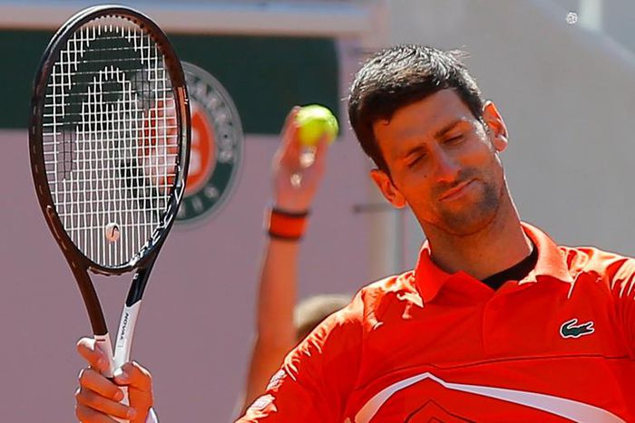 Serbia's Novak Djokovic reacts after missing a shot against Austria's Dominic Thiem in their semifinal match of the French Open tennis tournament at the Roland Garros stadium in Paris, Saturday, June 8, 2019. (AP Photo/Michel Euler)