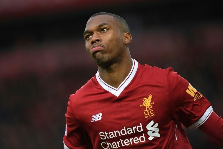 Liverpool striker Daniel Sturridge celebrates after scoring the opening goal of the English Premier League match against Huddersfield Town at Anfield in Liverpool, north west England, on October 28, 2017