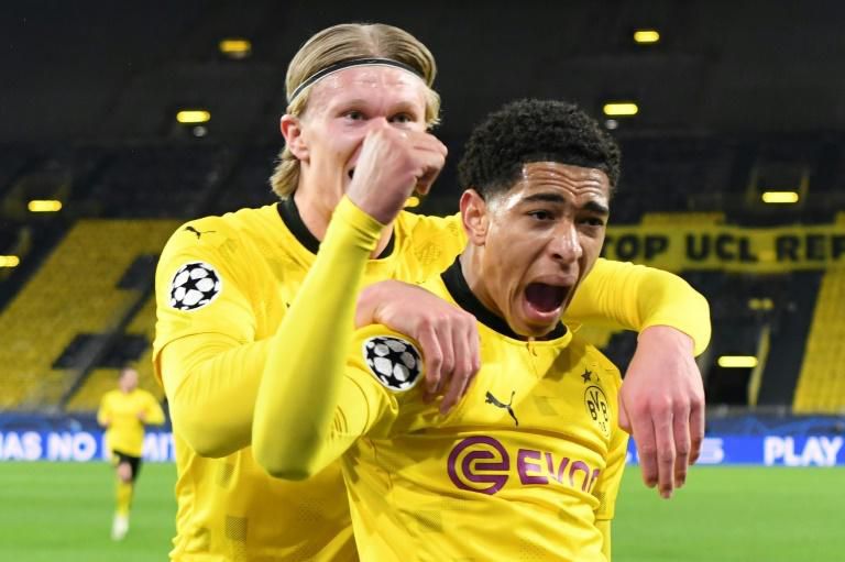 Jude Bellingham (R) celebrates scoring the opening for Dortmund in Wednesday's defeat to Manchester City
