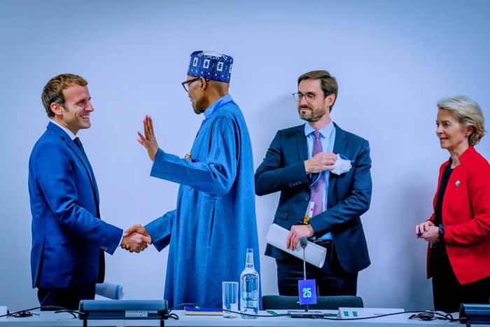 President Muhammadu Buhari shakes President Emmanuel Macron [Presidency]