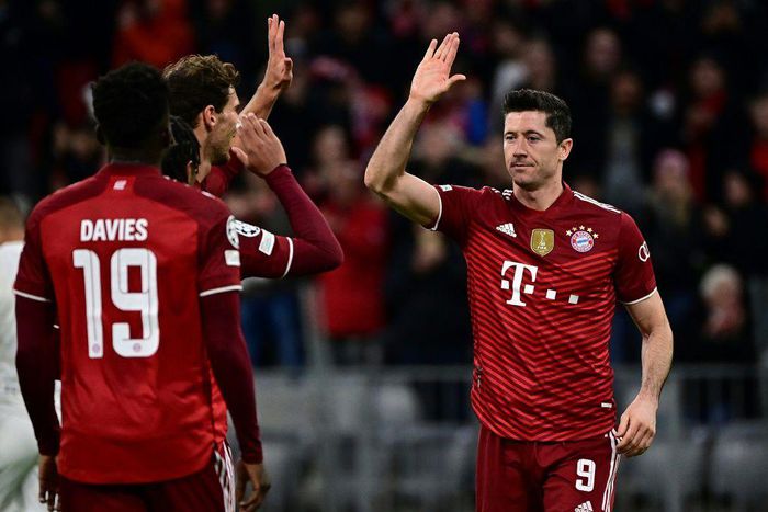 Robert Lewandowski (R) celebrates his early goal for Bayern Munich, but later had a weak penalty attempt saved