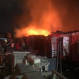 Fire razes shop