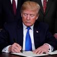 U.S. President Donald Trump signs a memorandum on tariffs on high-tech goods from China, at the White House in March 2018.REUTERS/Jonathan Ernst