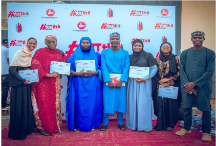 Youths in Kano state with their certificates at the end of the session on 23 September