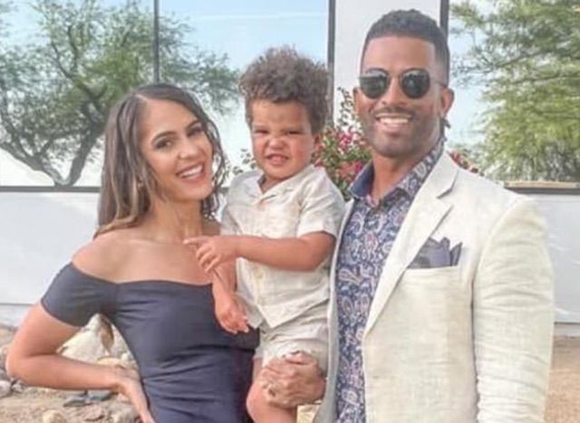 Janine Tate, her husband and their child