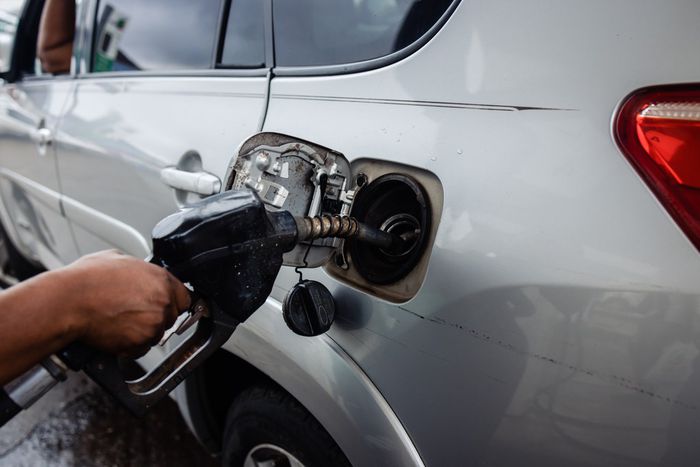 A fuel attendant refuels a customer's vehicle at a gas station in the Yaba suburb of Lagos, Nigeria, on Saturday, July 29, 2023. [Getty Images]