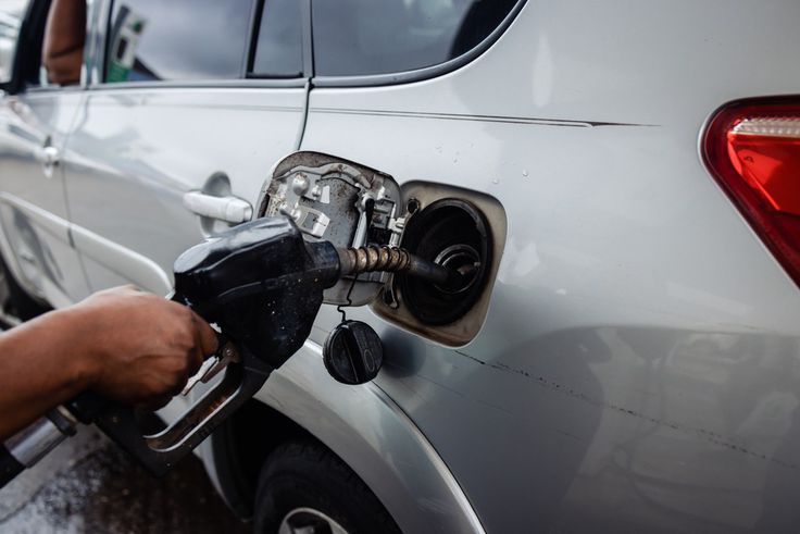 A fuel attendant refuels a customer's vehicle at a gas station in the Yaba suburb of Lagos, Nigeria, on Saturday, July 29, 2023. [Getty Images]