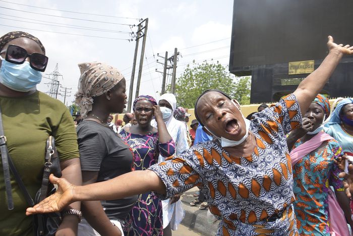 A woman react during a disgruntled faction of older women and Inspired group march with a banner during a walk demanding better government due to the recent hike in insecurity, hunger and inequality. [Getty Images]