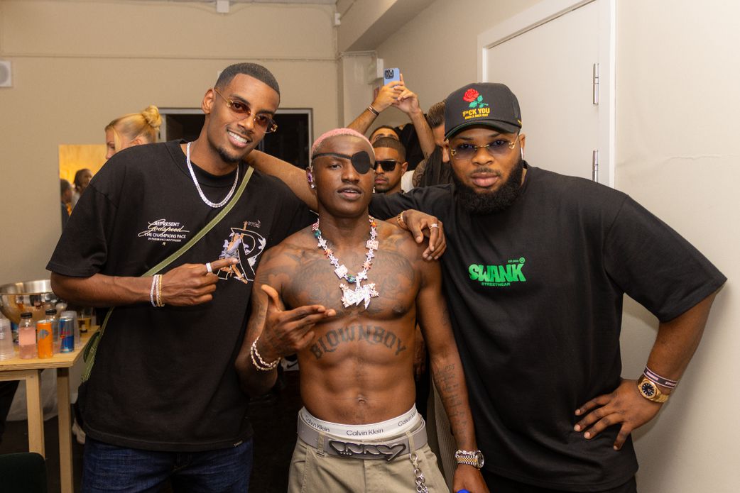 Ogbu, Ruger, and footballer Alexander Isak at a Ruger concert