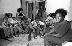Urban poor people deal with overcrowded housing [DigitalCommonwealth]