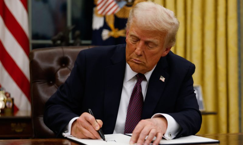 President Donald Trump signs executive orders in the Oval Office of the White House on January 20, 2025 in Washington, DC. Trump takes office for his second term as the 47th president of the United States. [Getty Images]