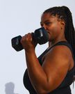 Woman lifting weights outdoors