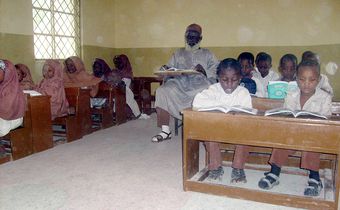 Entertainment news Celebrity gossip Movie and TV show updates Latest celebrity news Trending entertainment stories Abubakar Muhammad Barinjimi (C), an 88 year-old pupil, sits in the classroom at Nigeria-Egyptian Model School in Kano, the northern Nigerian commercial capital. [Getty Images]