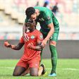 Sierra Leone's goalkeeper Mohamed Nbalie Kamara (L) and Sierra Leone's defender Steven Caulker (R) react after a draw in the Group E Africa Cup of Nations (CAN) 2021 football match between Algeria and Sierra Leone at Stade de Japoma in Douala on Januar...
