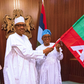 Osun election: Buhari presents APC flag to guber candidate Oyetola