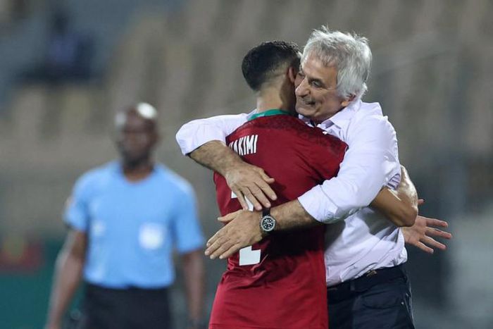 Match-winner Hakimi embraced by his coach.