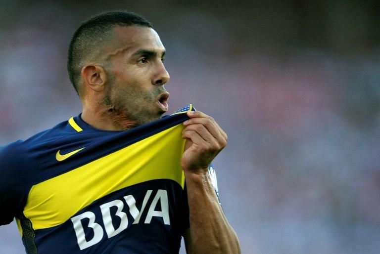Boca Juniors' forward Carlos Tevez celebrates after scoring on December 11, 2016